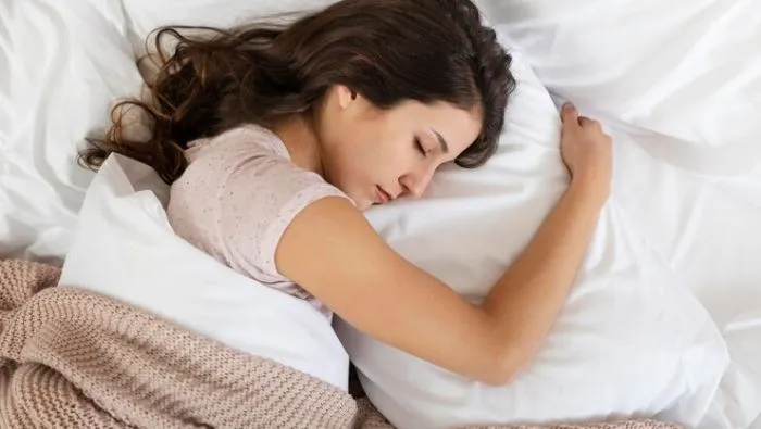 People who hug a pillow while sleeping tend to be highly empathetic. They also enjoy showing care by giving hugs, listening attentively, and making eye contact.