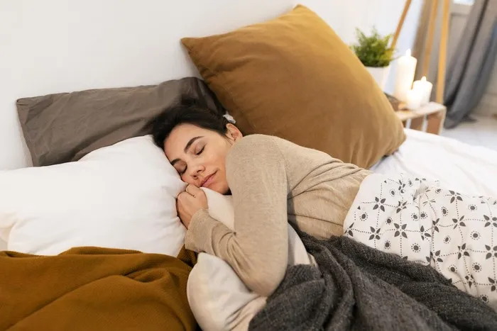 The habit of hugging a pillow while sleeping might be a reactivated self‑defence pattern from childhood, especially during times of stress or difficulty coping with life’s pressures. It can also be a way to reconnect with your 'inner child'.