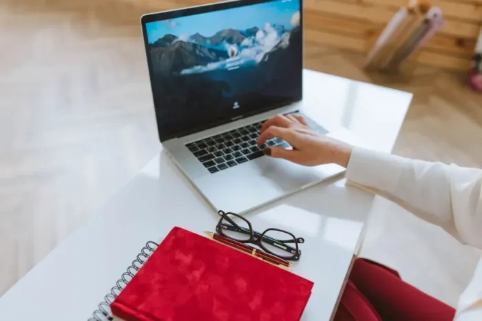 A person is considering signing up for an online class using a laptop