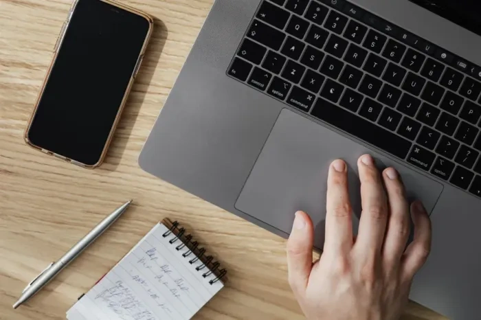 Simple business planning with laptop, notebook, and calculator